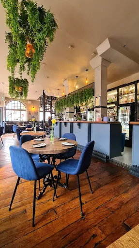 The Bank interior - tables and hanging greenery